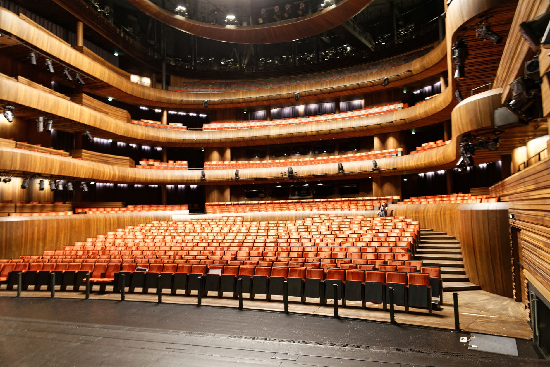 theatre stage audience red seats