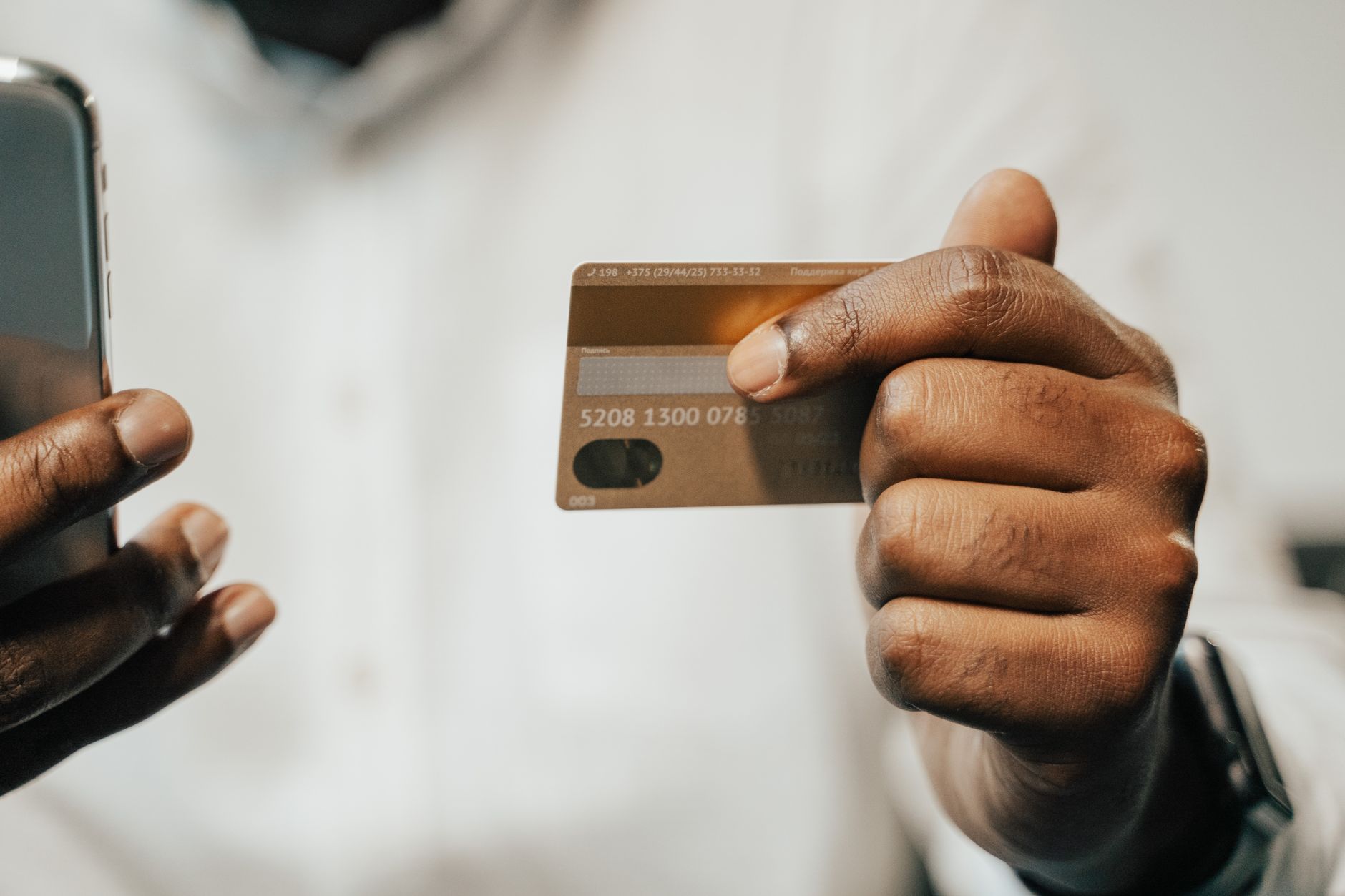 smartphone payment card hand