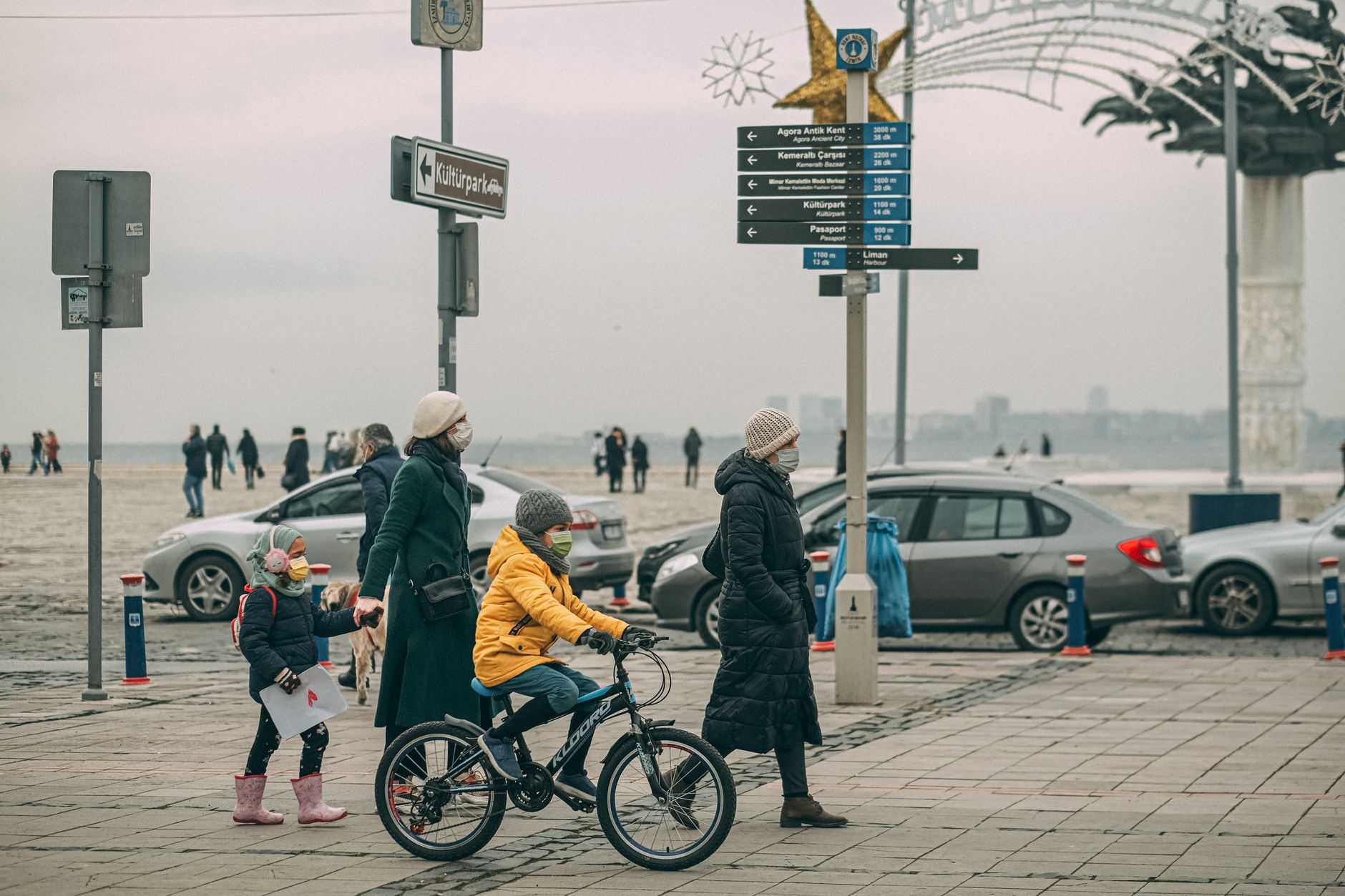 family walking city street